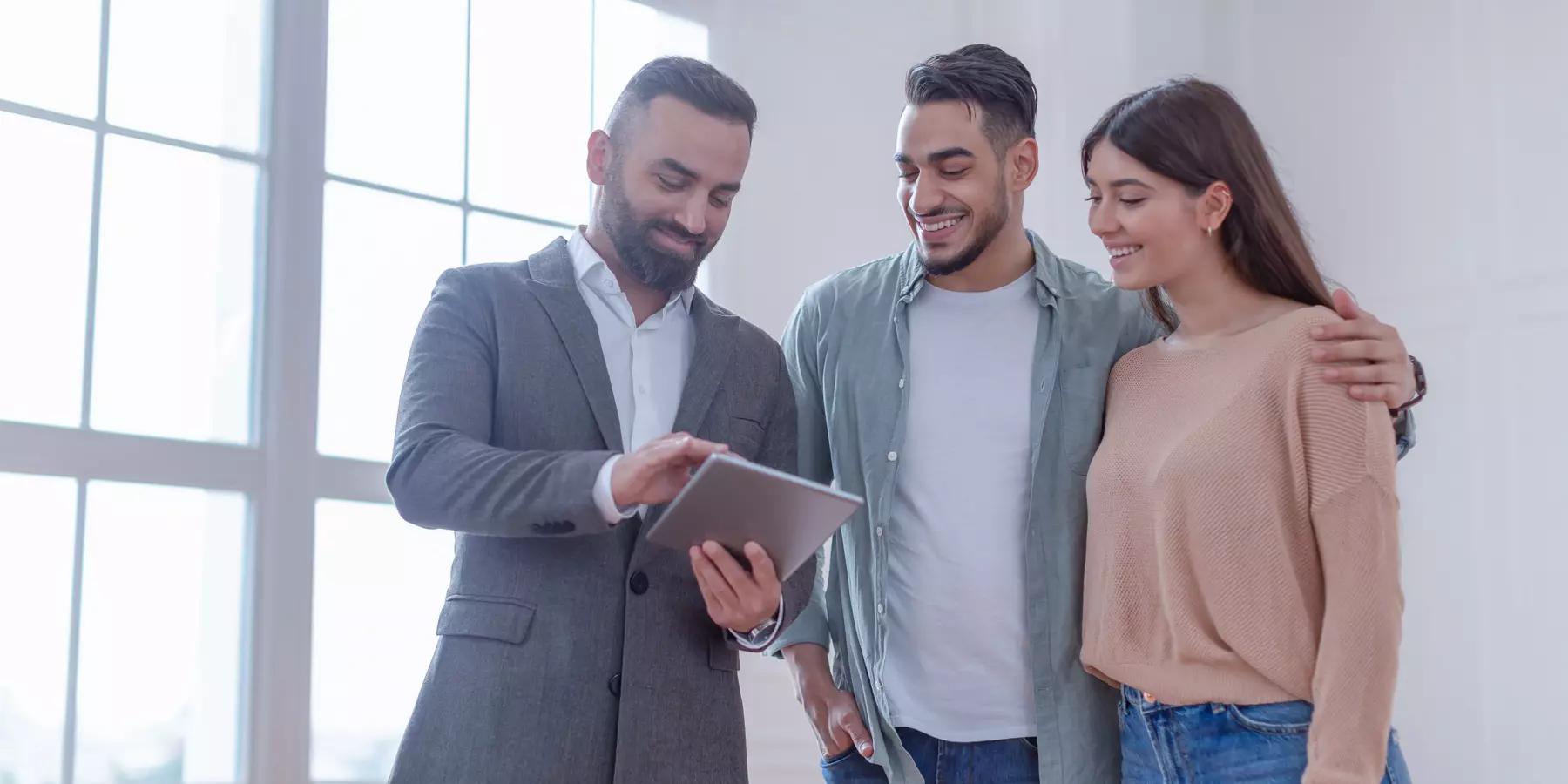 couple being advised on financial investments by a financial advisor