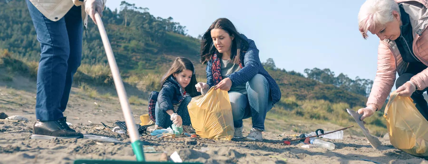 mother and daughter being cause champions for beach pollution