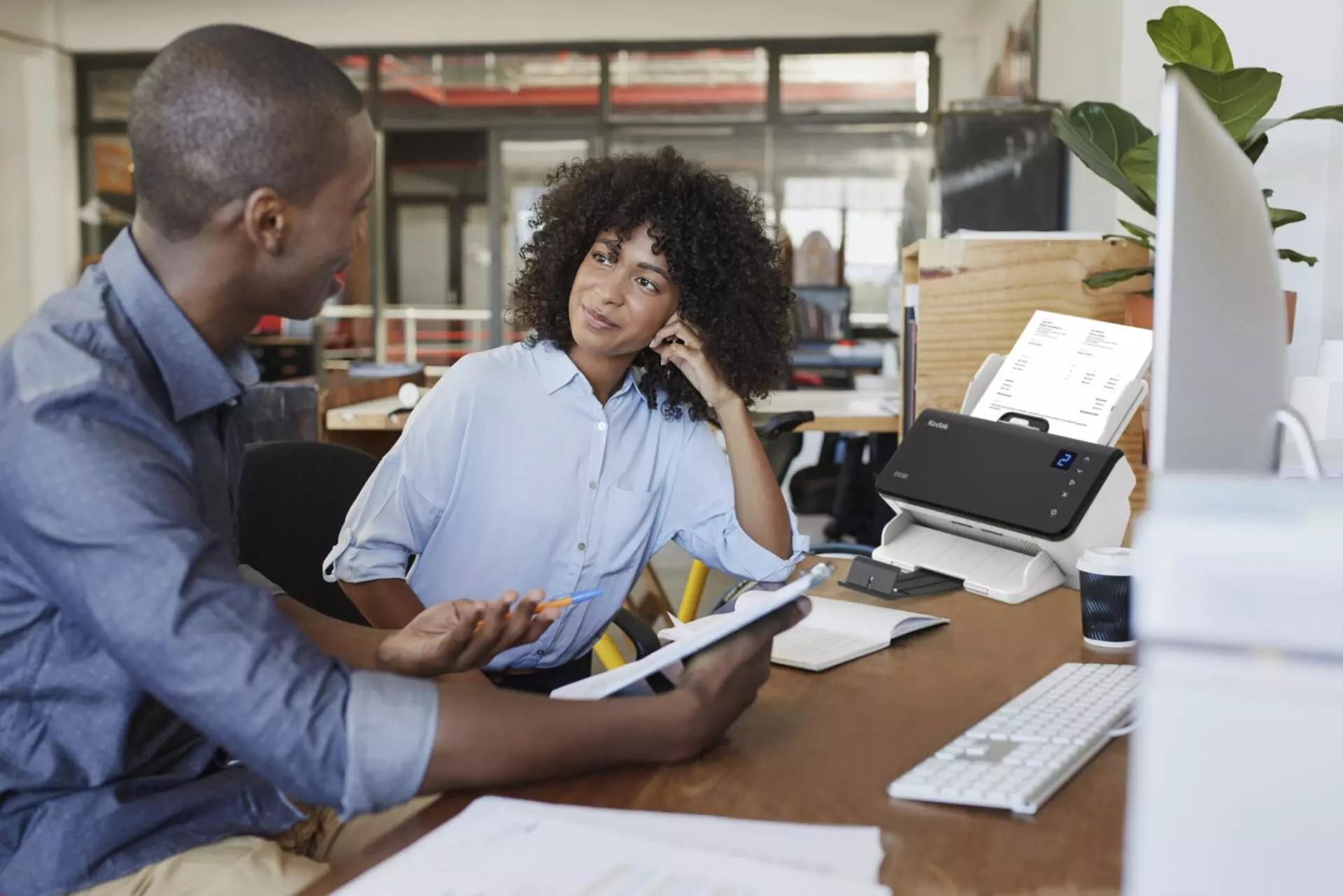 two people in conversation in an office